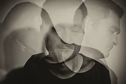 Black-and-white double exposure of a man's head seen from multiple angles, suggesting inner conflict or multiple selves.